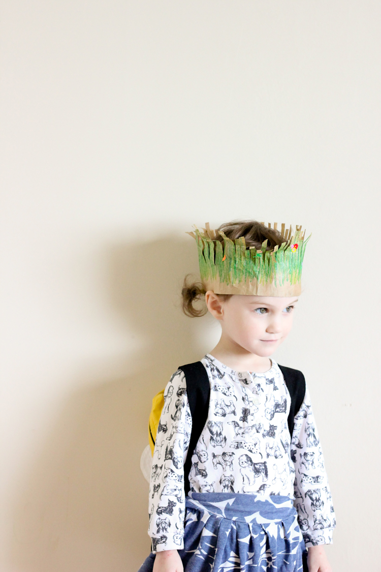 Whip up these easy, toddler friendly paper grass crowns for Earth Day! // via Delia Creates