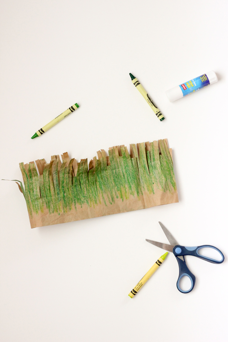 Whip up these easy, toddler friendly paper grass crowns for Earth Day! // via Delia Creates
