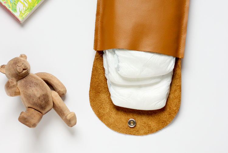 Make this simple leather diaper clutch using this really easy tutorial. // Delia Creates