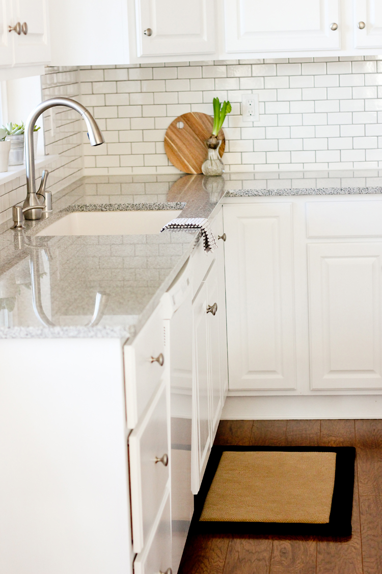 Kitchen Renovation Series: Painting Our Kitchen Cabinets White - with Chalk Paint! // www.deliacreates.com