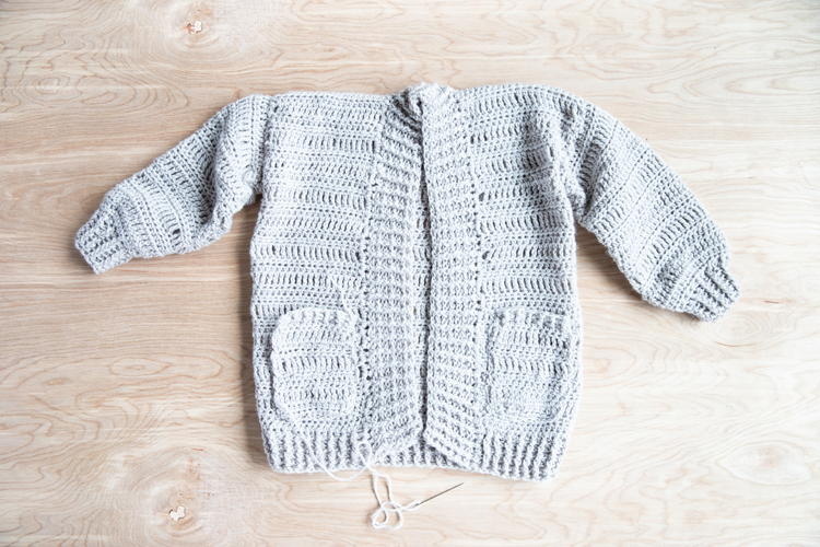 Oversized Crocheted Cardigan FREE PATTERN + Tutorial // www.deliacreates.com // Learn how to make a crocheted cardigan using just basic stitches! Perfect for cozy fall weather! #crochet #crochetsweater #crochetforfall