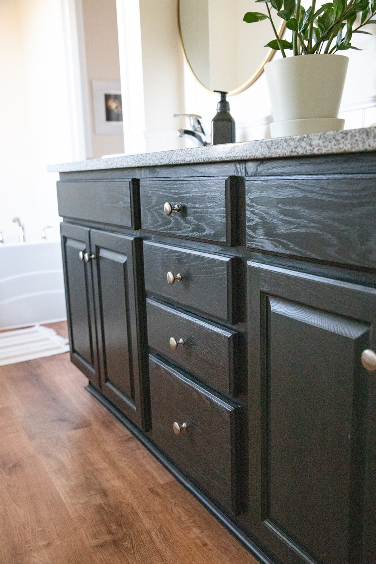 Bathroom Makeover on A Budget, Part One - Painting our Cabinets with Chalk Paint, Fixtures, and Flooring // www.deliacreates.com