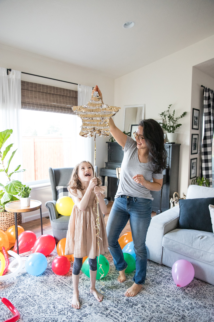 7 Easy ways to make New Year's Eve fun for kids and families! // Pull a string pinata when counting down! // www.deliacreates.com