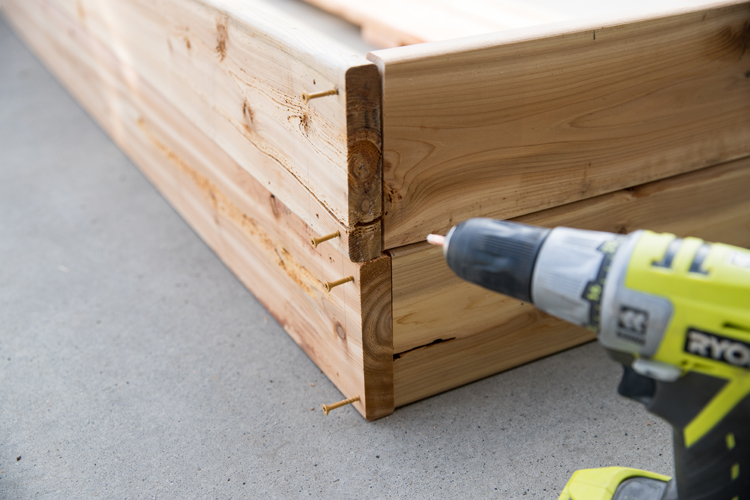 How To Make Cedar Raised Garden Beds // www.deliacreates.com// step by step tutorial with pictures