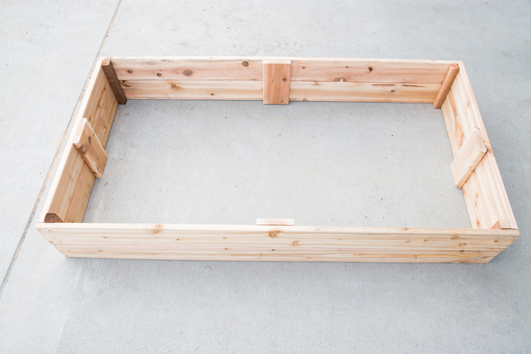 How To Make Cedar Raised Garden Beds // www.deliacreates.com// step by step tutorial with pictures