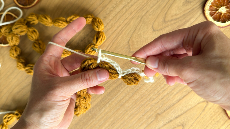 Chains + Puffs Crochet Garland // free pattern and video tutorial at www.deliacreates.com