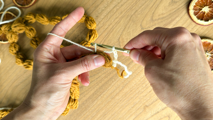 Chains + Puffs Crochet Garland // free pattern and video tutorial at www.deliacreates.com