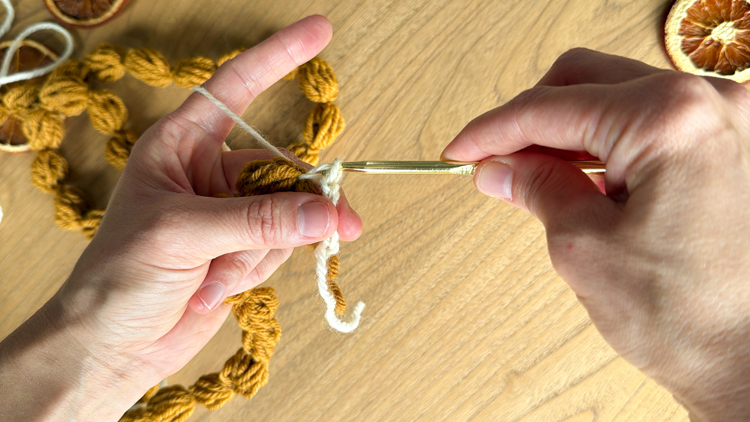 Chains + Puffs Crochet Garland // free pattern and video tutorial at www.deliacreates.com