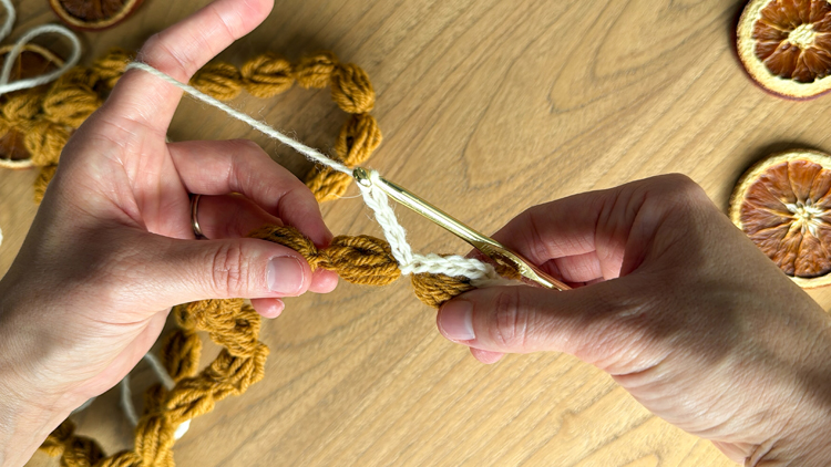 Chains + Puffs Crochet Garland // free pattern and video tutorial at www.deliacreates.com